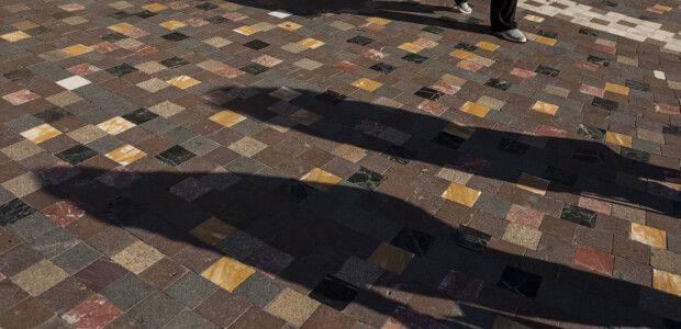 Photo: Shadows of 2 people on a pavement